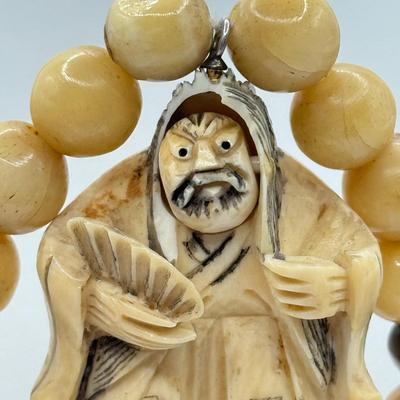 LOT 44J: Japanese Netsuke on Long Prayer Bead Necklace - Laughing / Angry Buddha Toggle Face