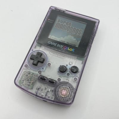 LOT 166F: Nintendo GameBoy Color Transparent Purple Model CGB-0010 (Works, Missing battery cover), Super Mario Bros Deluxe & 101...