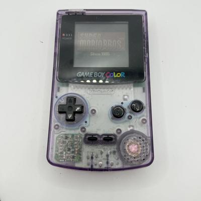 LOT 166F: Nintendo GameBoy Color Transparent Purple Model CGB-0010 (Works, Missing battery cover), Super Mario Bros Deluxe & 101...