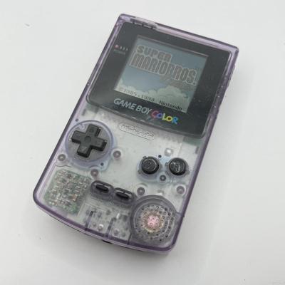 LOT 166F: Nintendo GameBoy Color Transparent Purple Model CGB-0010 (Works, Missing battery cover), Super Mario Bros Deluxe & 101...