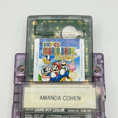 LOT 166F: Nintendo GameBoy Color Transparent Purple Model CGB-0010 (Works, Missing battery cover), Super Mario Bros Deluxe & 101...