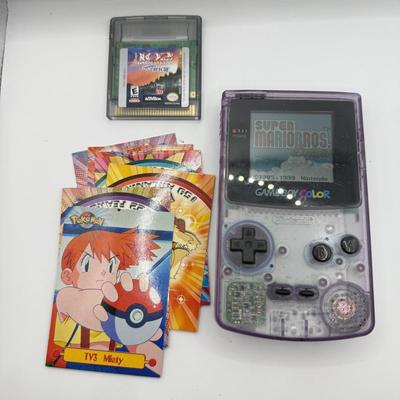 LOT 166F: Nintendo GameBoy Color Transparent Purple Model CGB-0010 (Works, Missing battery cover), Super Mario Bros Deluxe & 101...