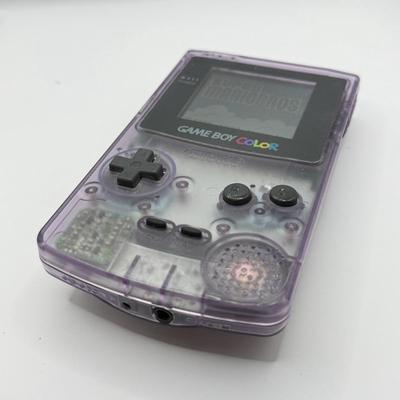 LOT 166F: Nintendo GameBoy Color Transparent Purple Model CGB-0010 (Works, Missing battery cover), Super Mario Bros Deluxe & 101...