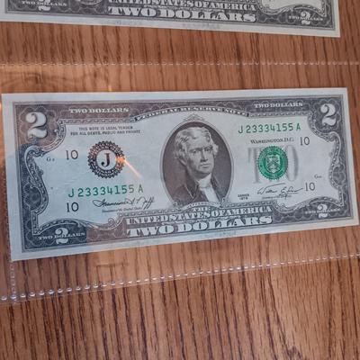 SIX 2 DOLLAR BILLS 2 FROM LEFT SIDE AND 2 FROM RIGHT ARE SEQUENCIAL