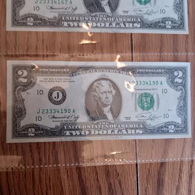 SIX 2 DOLLAR BILLS 2 FROM LEFT SIDE AND 2 FROM RIGHT ARE SEQUENCIAL