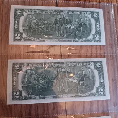 SIX 2 DOLLAR BILLS 2 FROM LEFT SIDE AND 2 FROM RIGHT ARE SEQUENCIAL