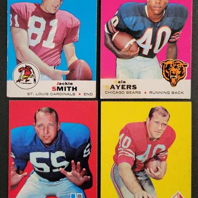 Sale Photo Thumbnail #697: 1969 Topps Various Players. (20 CARDS) Fred Hill card has damage on right top corner
Gale Sayers, Jackie Smith (2), Gary Ballman, Bob Cappadona, Dan Abramowicz RC, Boyd Dowler, Bob Matheson, Bryon Piccolo RC, Sherrill Headrick
Fred Hill, Walt Suggs, Rudy 