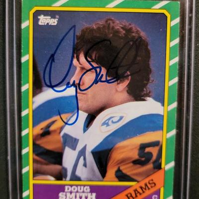 Sale Photo Thumbnail #758: 1986 Topps Doug Smith SIGNED NO COA
1991 Score Tom Newberry. SIGNED NO COA
1989 Topps Mike Wilcher SIGNED NO COA
NO COA'S for signed cards.