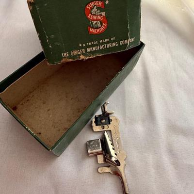 Sale Photo Thumbnail #61: Box of 3 vintage singer sewing feet attachments 
1 - 160359
1 - ruffler 
1 - 35931