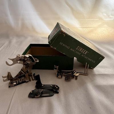 Sale Photo Thumbnail #59: Box of 3 vintage singer sewing feet attachments 
1 - 160359
1 - ruffler 
1 - 35931