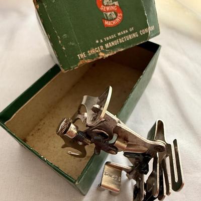Sale Photo Thumbnail #60: Box of 3 vintage singer sewing feet attachments 
1 - 160359
1 - ruffler 
1 - 35931