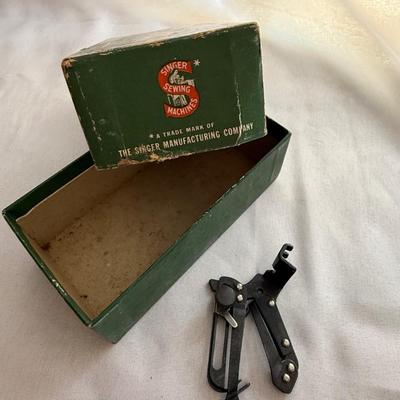 Sale Photo Thumbnail #62: Box of 3 vintage singer sewing feet attachments 
1 - 160359
1 - ruffler 
1 - 35931