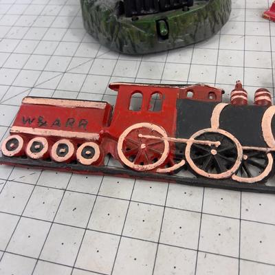 Cast Iron:   Bank, Nut Cracker and a Wall Plaque 