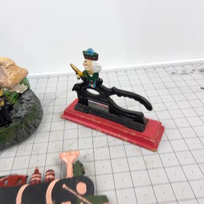 Cast Iron:   Bank, Nut Cracker and a Wall Plaque 