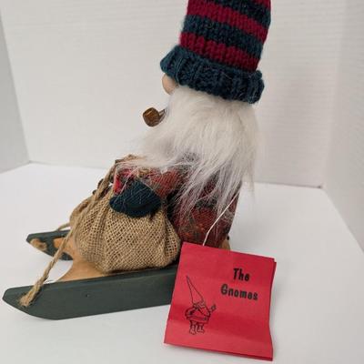 The Gnommery Christmas Gnome On Wooden Sled With Pipe And Gift Sack