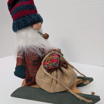 The Gnommery Christmas Gnome On Wooden Sled With Pipe And Gift Sack