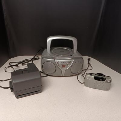 CANON SURE SHOT 35MM & POLAROID CAMERA PLUS A CURTIS RADIO/CD PLAYER (NO ANTENNA)