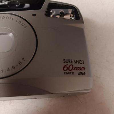 CANON SURE SHOT 35MM & POLAROID CAMERA PLUS A CURTIS RADIO/CD PLAYER (NO ANTENNA)