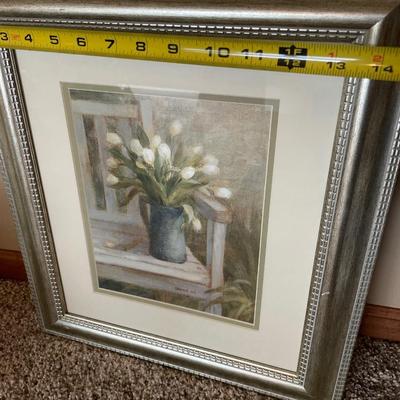 Faux plant with wall decor