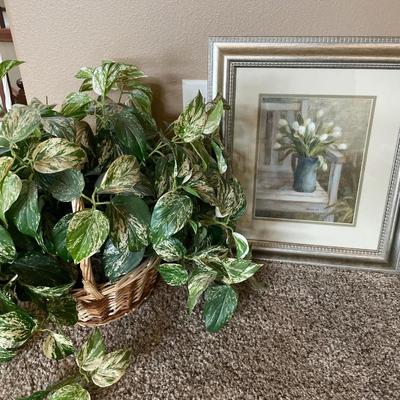Faux plant with wall decor