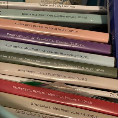 Green plastic bin with crafting CDs & books