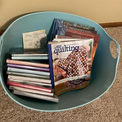 Green plastic bin with crafting CDs & books
