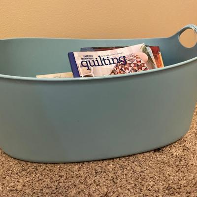 Green plastic bin with crafting CDs & books