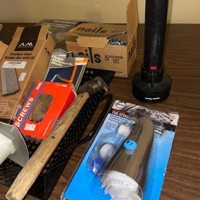 Hammer, nails and motor cover