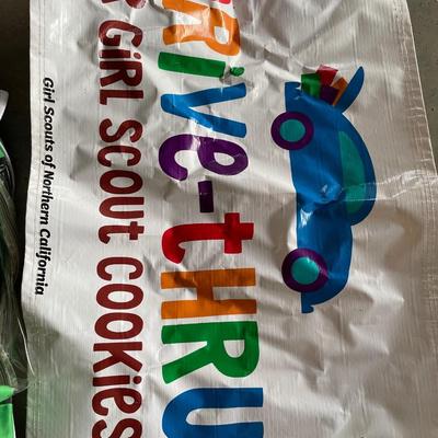 Girl Scout cookies carrying tote with signs and bags