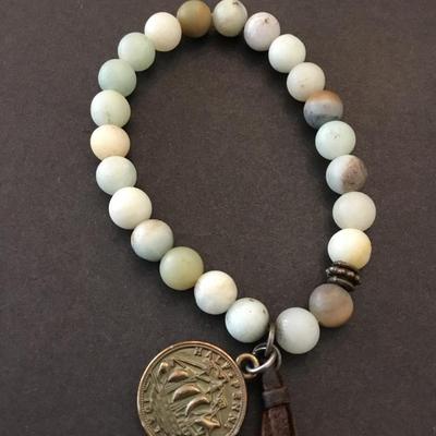 Beautiful stone bead bracelet with tassel & faux coin charm