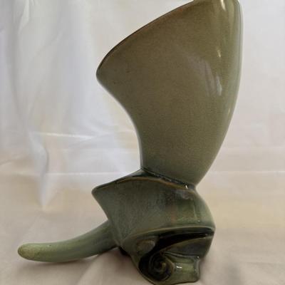 Sale Photo Thumbnail #171: Vintage Hull Art Pottery cornucopia vase from the "Parchment and Pine" line.
This line of pottery was manufactured by Hull Pottery between 1951 and 1954.