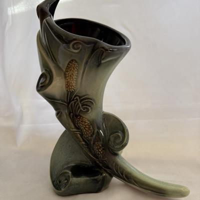 Sale Photo Thumbnail #170: Vintage Hull Art Pottery cornucopia vase from the "Parchment and Pine" line.
This line of pottery was manufactured by Hull Pottery between 1951 and 1954.