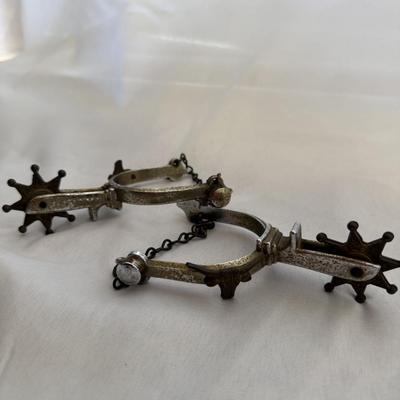 Sale Photo Thumbnail #176: Antique spurs with a longhorn