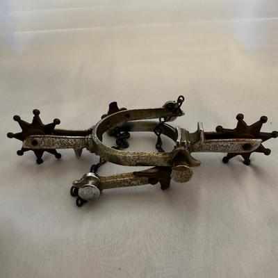 Sale Photo Thumbnail #177: Antique spurs with a longhorn