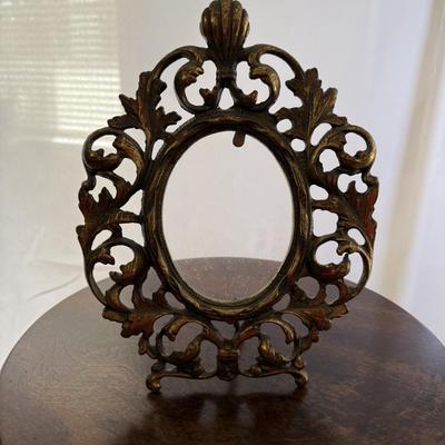 Sale Photo Thumbnail #241: Cast iron gilt table top picture frame