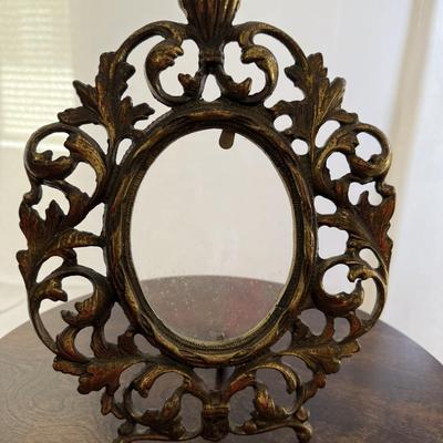Sale Photo Thumbnail #242: Cast iron gilt table top picture frame