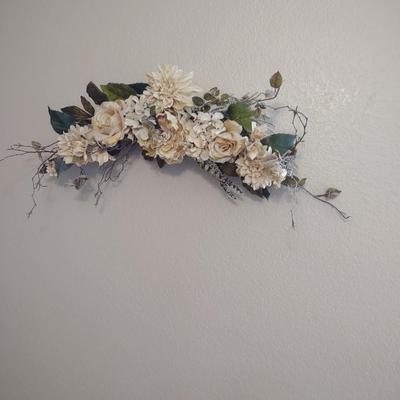 GLIDER, FAUX FLORAL SWAG AND A SIDE TABLE