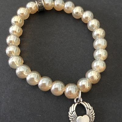 Beautiful luster, glass bead, stretch bracelet with charms