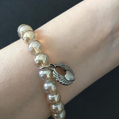 Beautiful luster, glass bead, stretch bracelet with charms