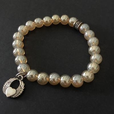 Beautiful luster, glass bead, stretch bracelet with charms