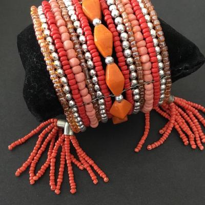 Very nice orange and silver beaded cuff bracelet. Super cute.