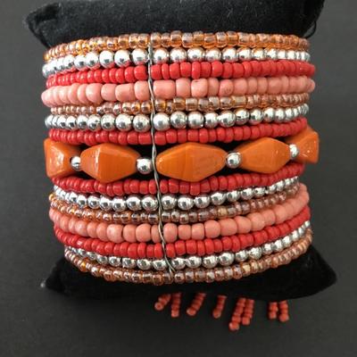 Very nice orange and silver beaded cuff bracelet. Super cute.