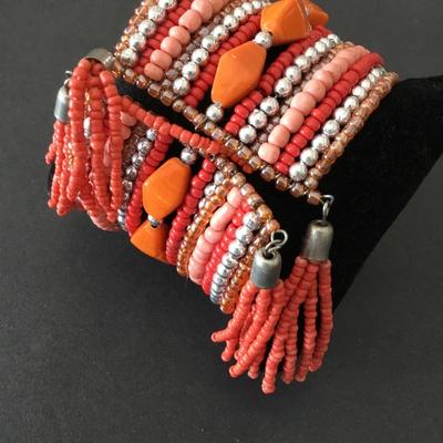 Very nice orange and silver beaded cuff bracelet. Super cute.