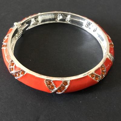 Very nice silver tone, orange enamel rhinestone, hinged bangle bracelet