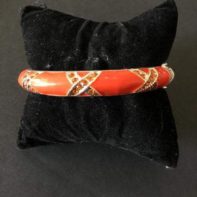 Very nice silver tone, orange enamel rhinestone, hinged bangle bracelet