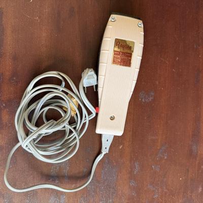 Sale Photo Thumbnail #268: Vintage Raycine electric hair clipper, Model 254.