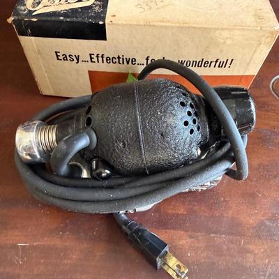 Sale Photo Thumbnail #276: 1950s handheld vibrating device that barbers would wear to provide a massage