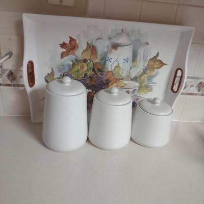 CANISTER SET AND A SERVING TRAY