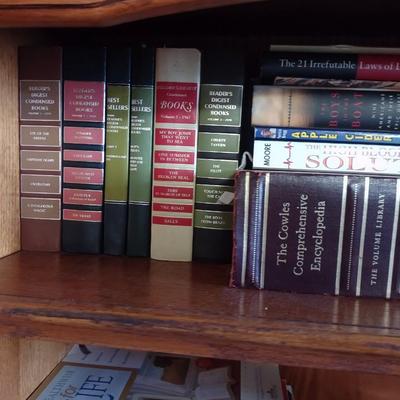 BOOKCASE WITH A VARIETY OF BOOKS