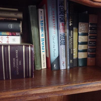 BOOKCASE WITH A VARIETY OF BOOKS